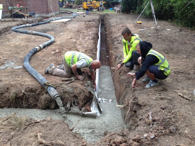 Pouring concrete into house footings