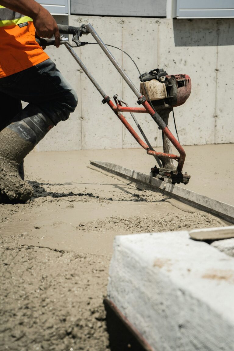 Power screeding a concrete floor