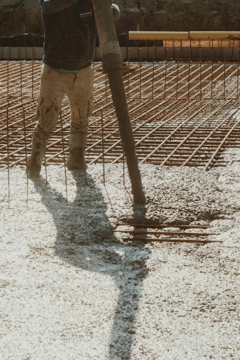 Ready mix concrete being poured over steel reinforcement
